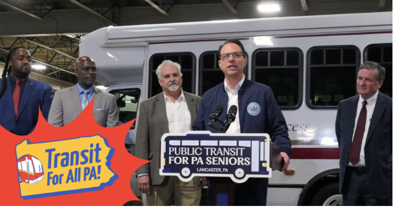 photo of Gov. Shapiro at a press conference Spring 2024. He standa behind a podium with a sign that says “Public Transit for PA Seniors, Lancaster PA”. At the bottom left is a graphic overlay with a red burst and the Transit for All PA! logo.